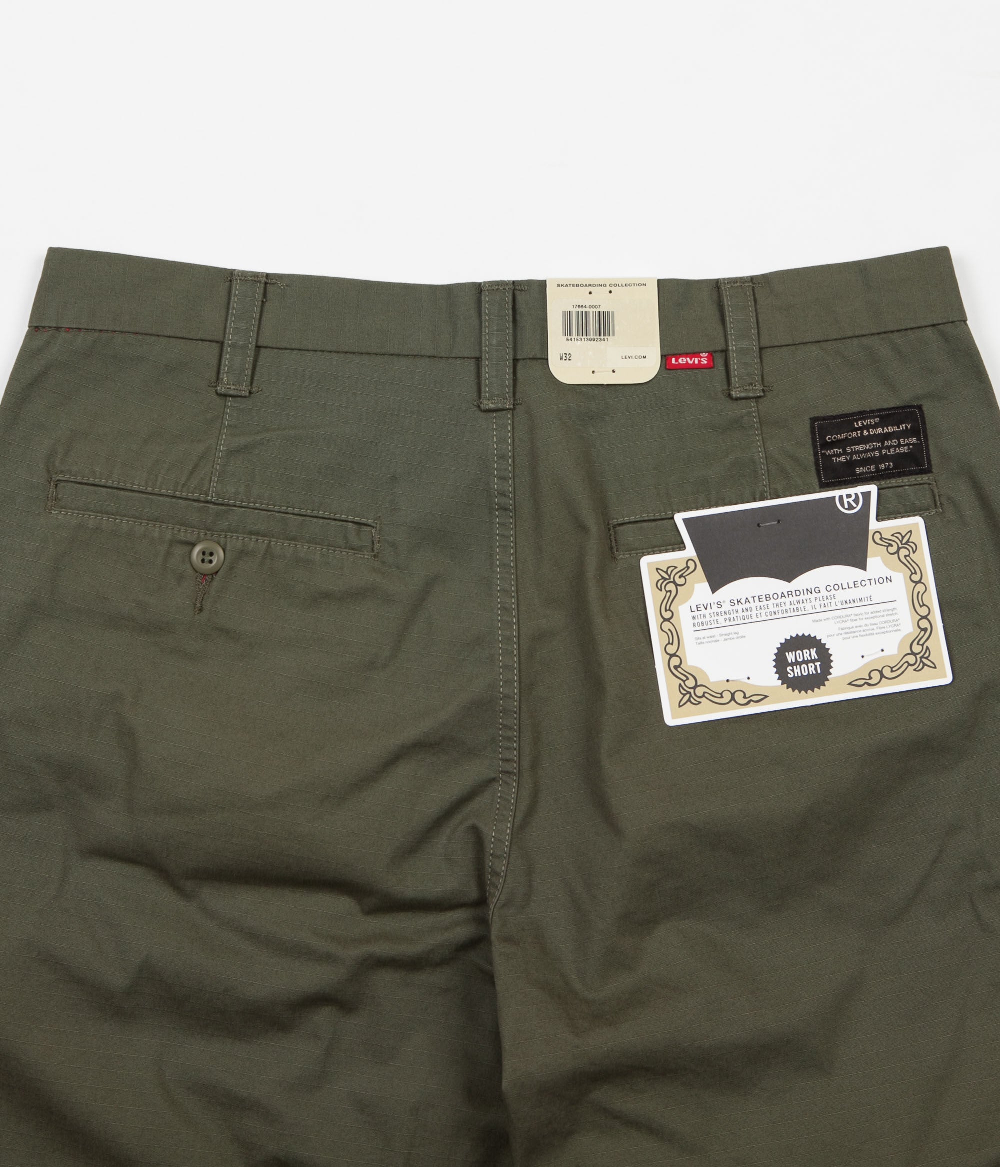 green levi shorts