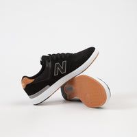 new balance dark grey all coasts 574 trainers