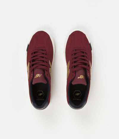 red and gold new balance