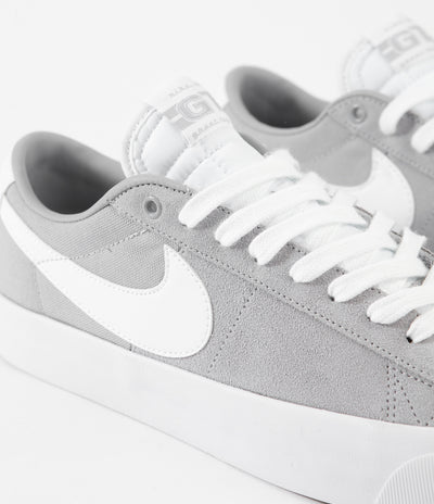 grey and white nike shoes