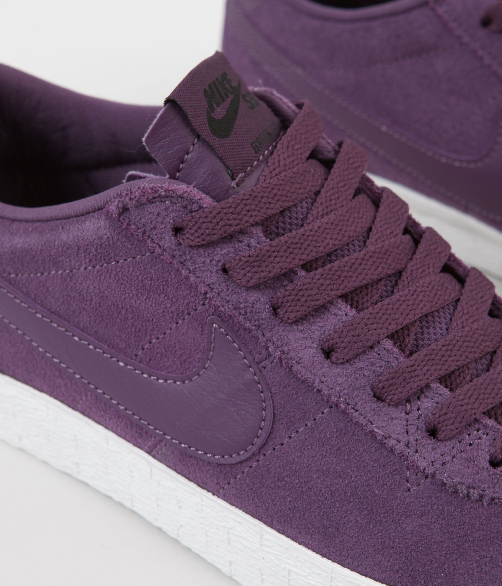 purple nike skate shoes