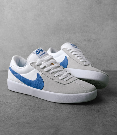 white and blue nike sb