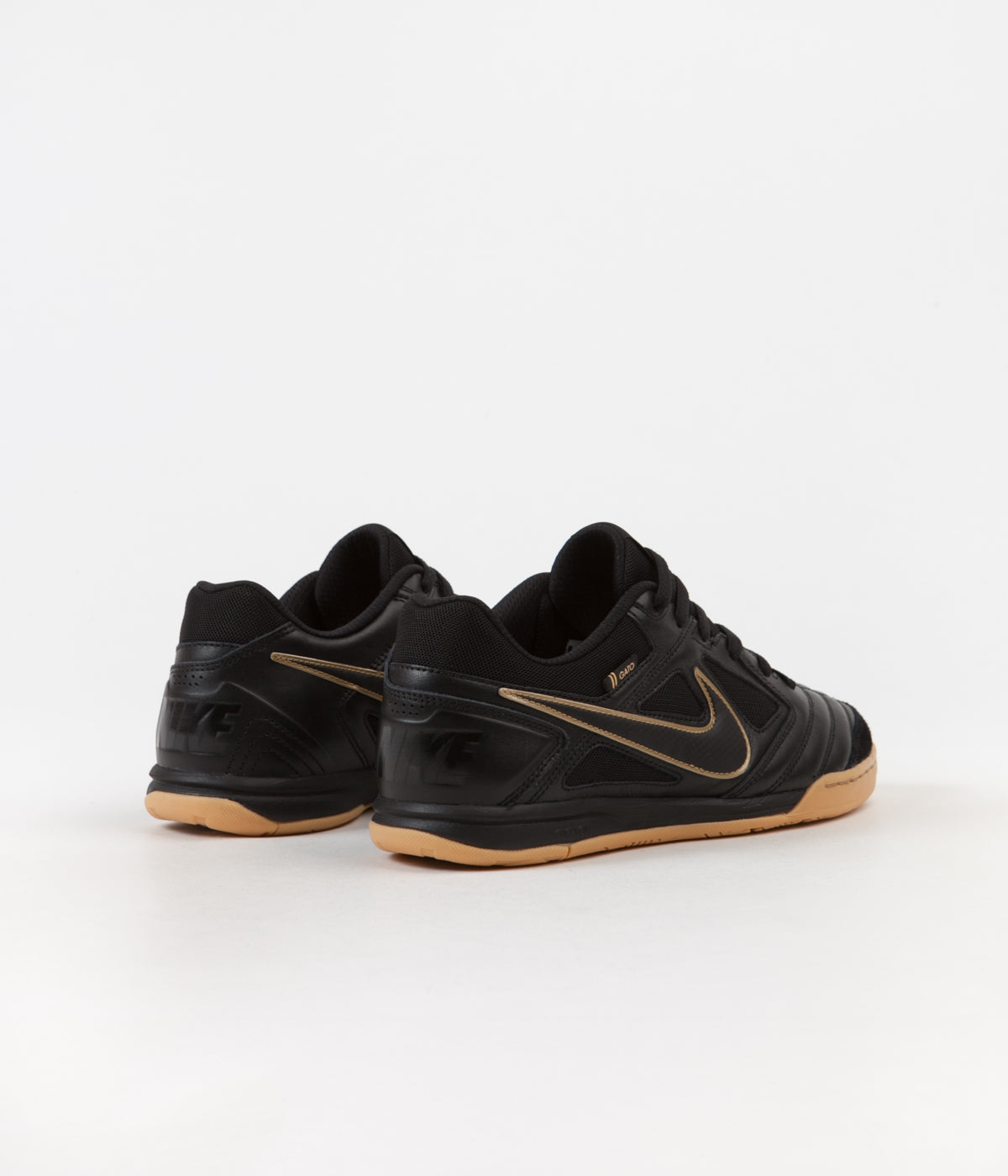 black and metallic gold nike shoes