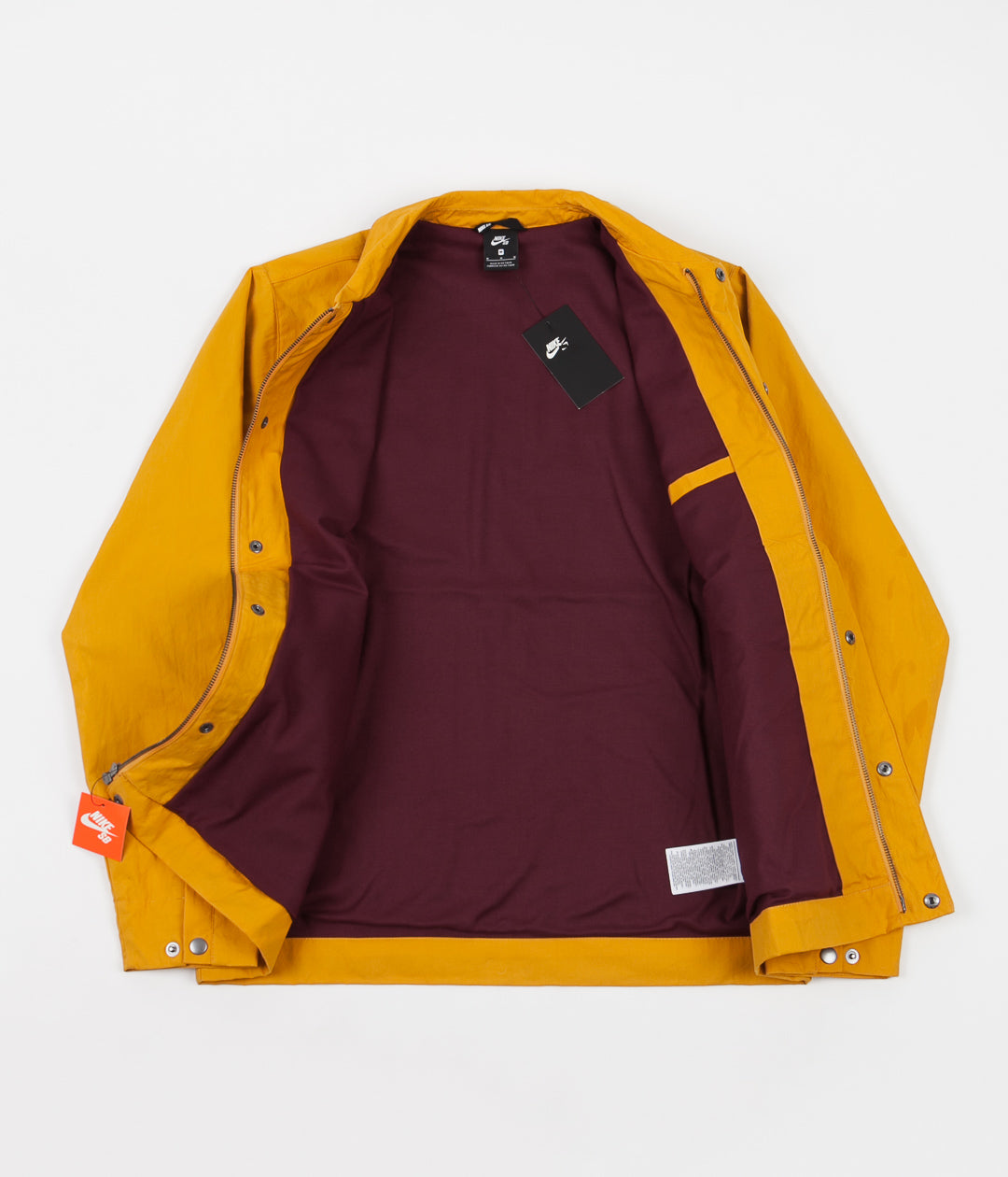 orange and burgundy nike windbreaker