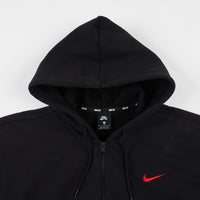 black nike jumper with red tick