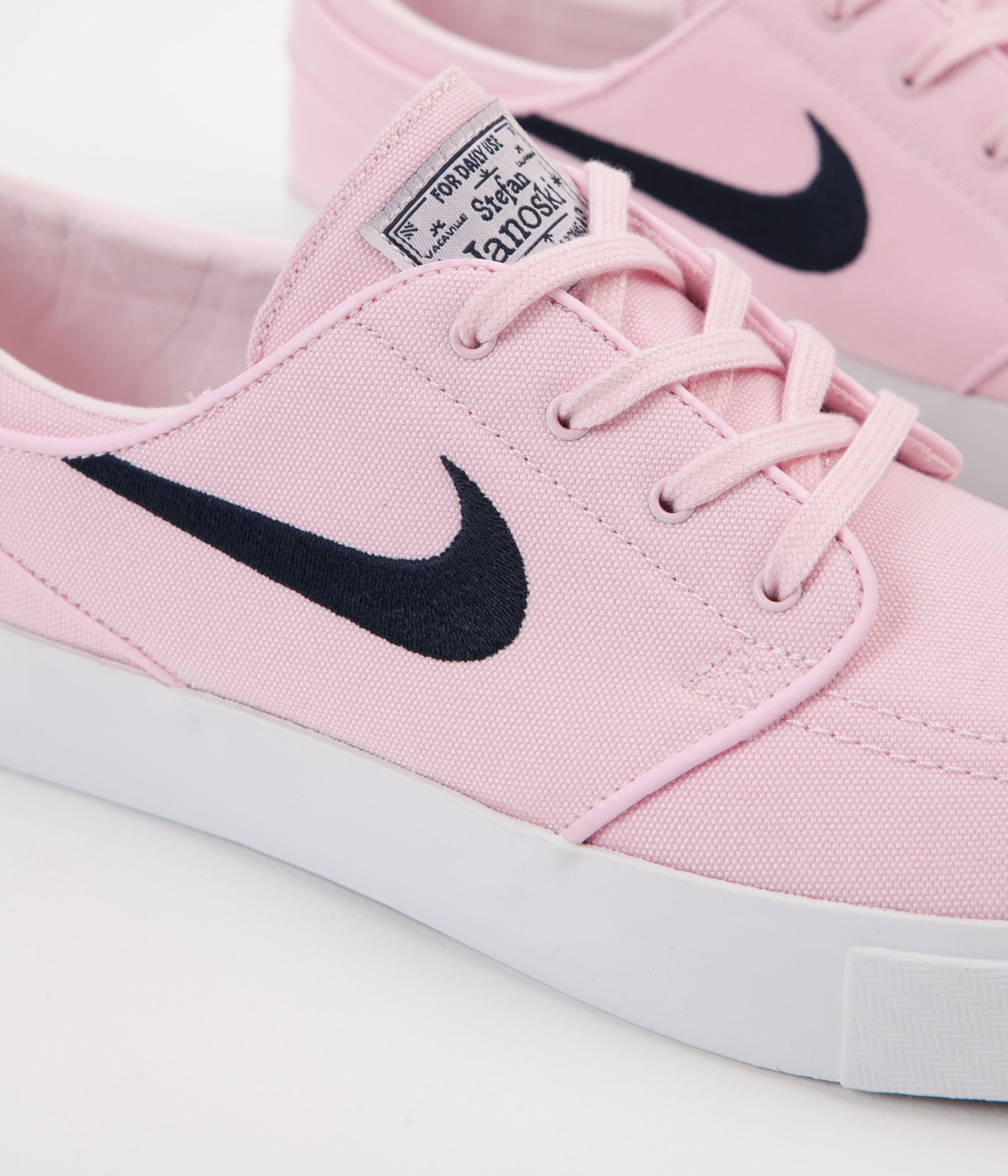 pink nike canvas shoes