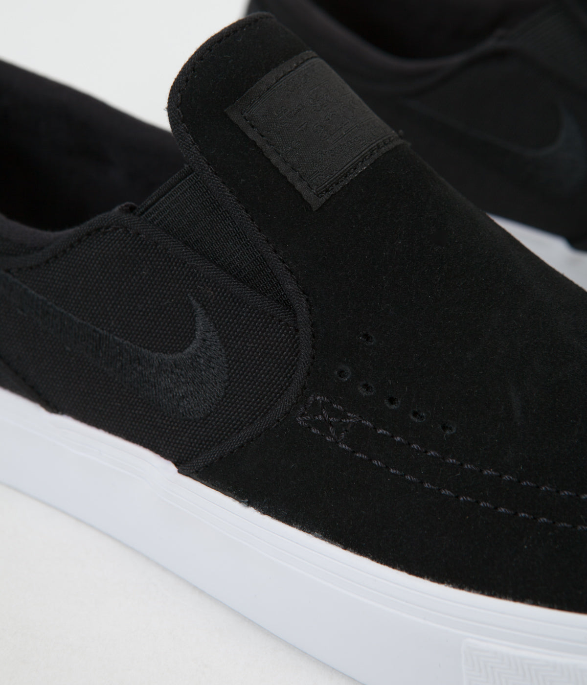 stefan janoski slip on black