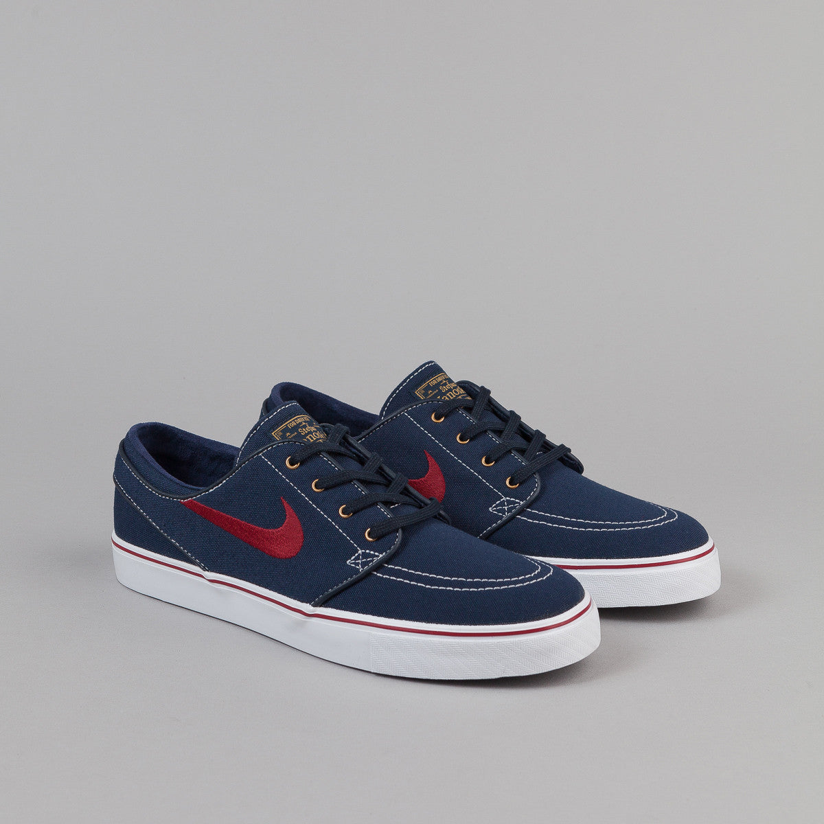 Nike SB Stefan Janoski Shoes - Obsidian / White / Metallic Gold / Team ...