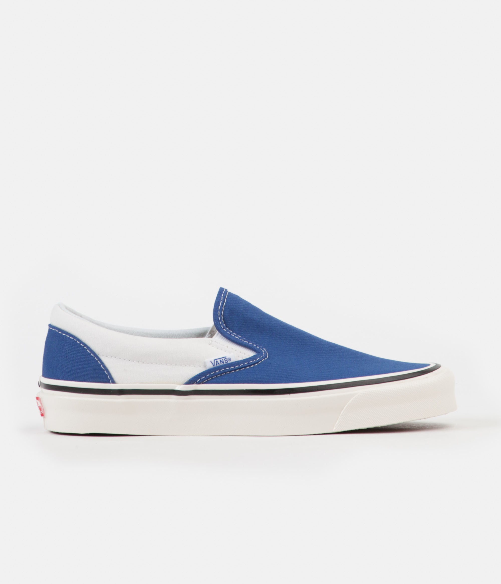 blue and white vans slip ons