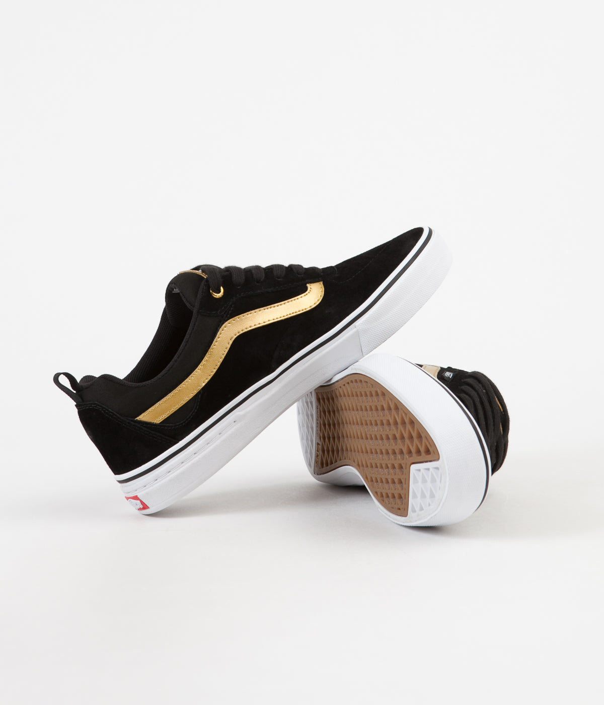 black vans with gold stripe