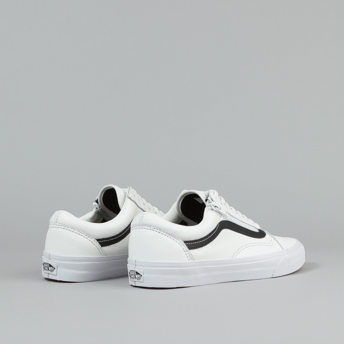 white leather vans with black stripe