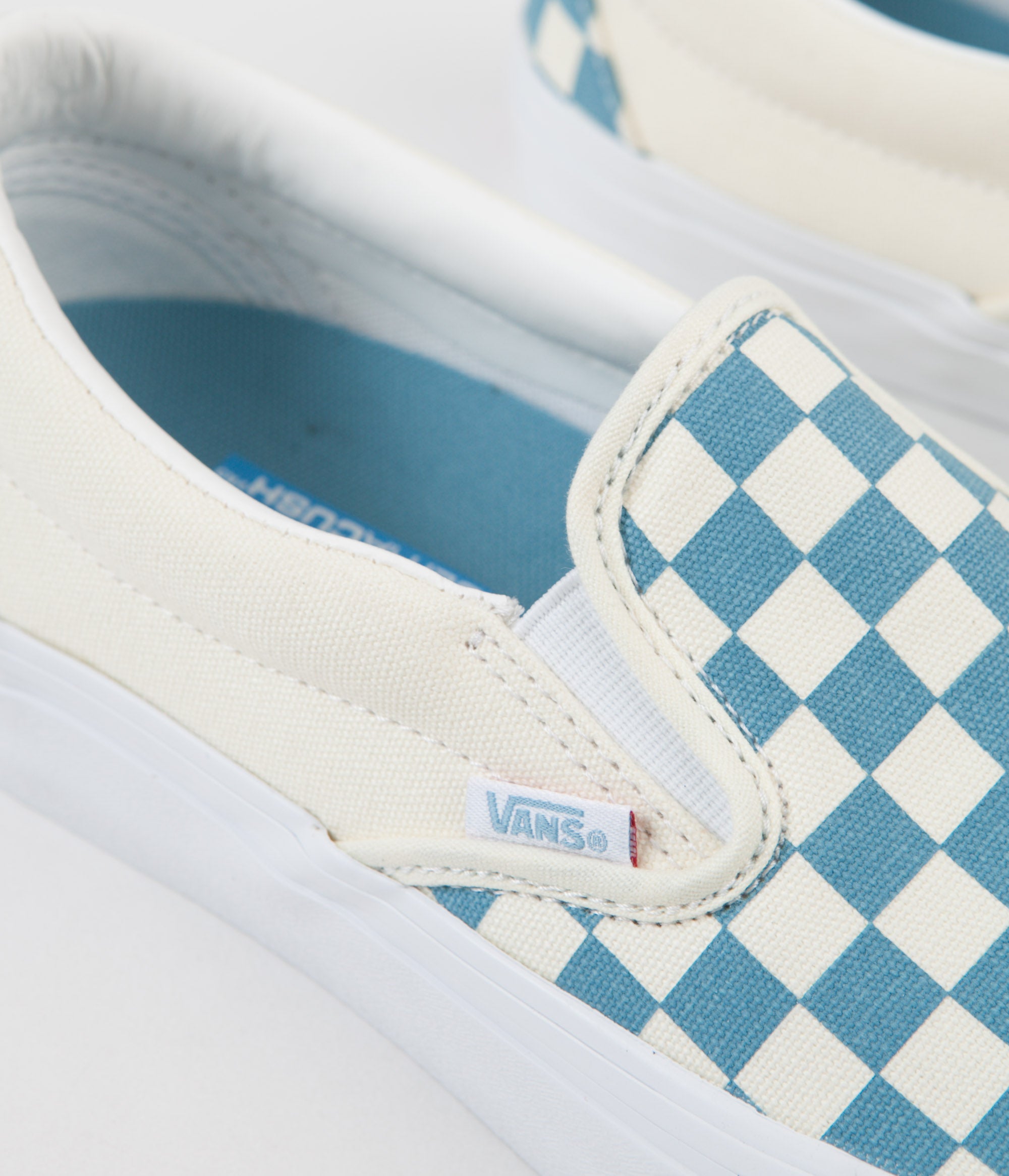 blue and white checkerboard slip on vans