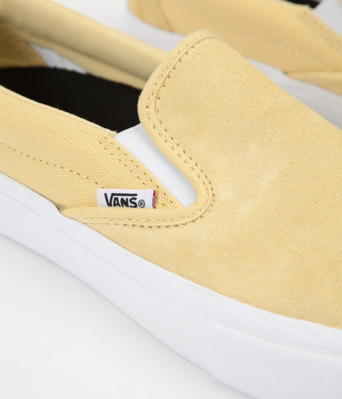 light yellow vans slip on