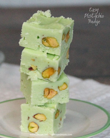 Cubes of pistachio fudge stacked on a plate