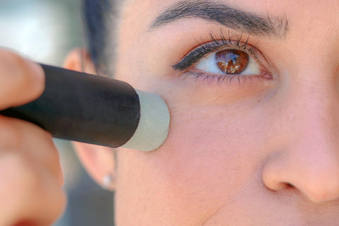 Applying cocoa butter and cacao butter to face