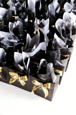 Luxury matte black conference bags with branded ribbon and marble tissue paper Sydney
