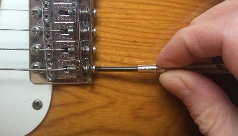 adjusting the intonation screw, lefty loosey and righty tighty