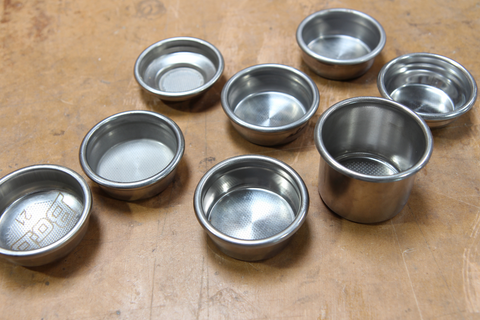 filter baskets in many sizes scattered on a table