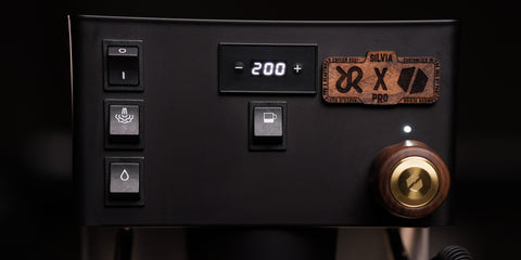 detail of control panel on heartwood espresso machine, with digital display and walnut and brass steam knob