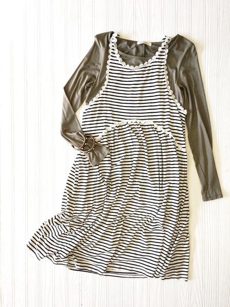 olive green long sleeve under a black & white stripe dress