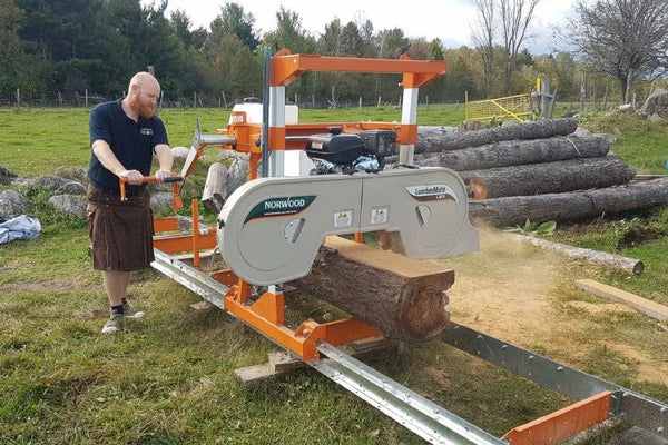 woodworker wears a utility kilt while operating a sawmill