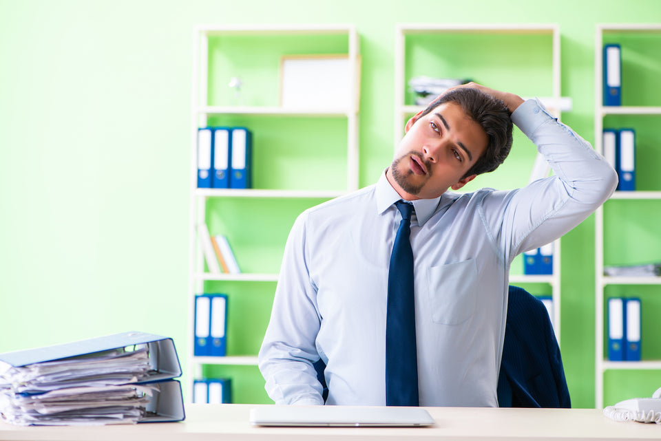 4 Easy Neck Stretches You Can Do At Your Desk To Make The Pain Go