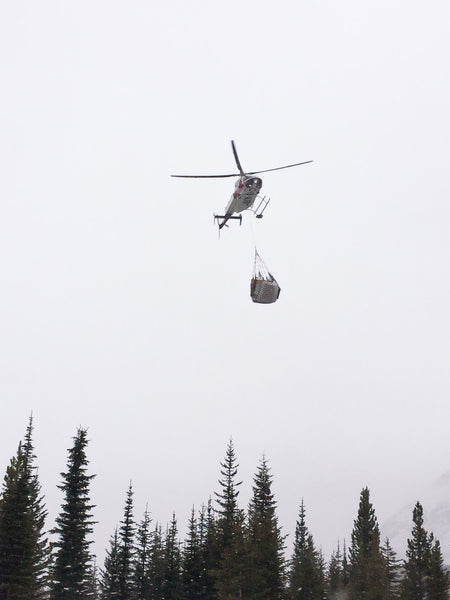 Mattresses being transported by helicopter