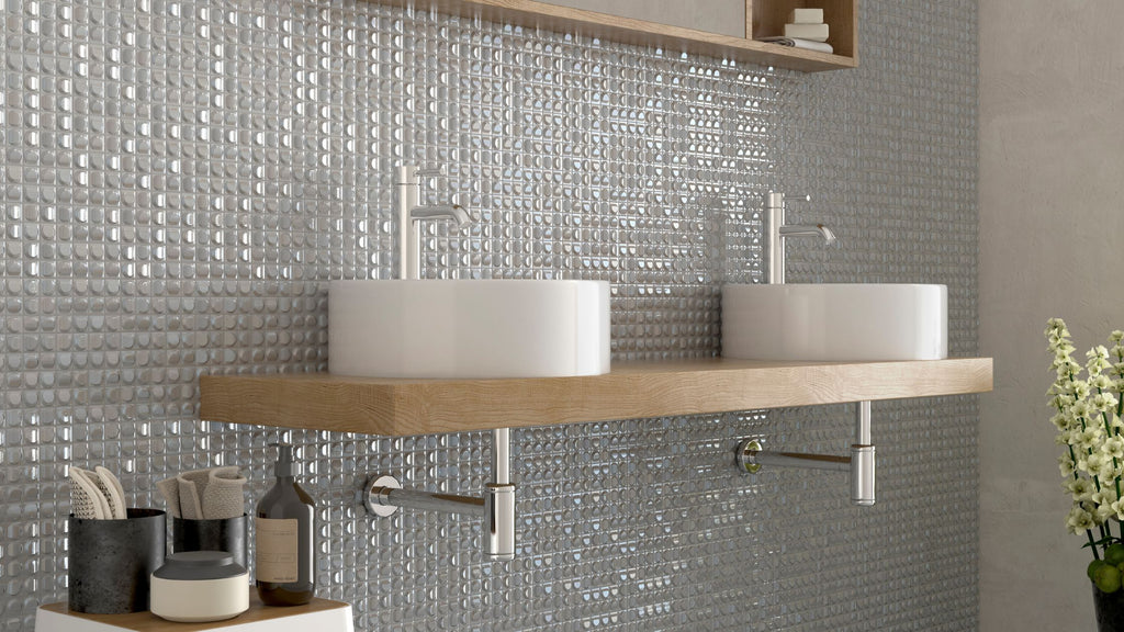 The Aura White tile installed in a bathroom wall that acts as a bathroom backsplash.