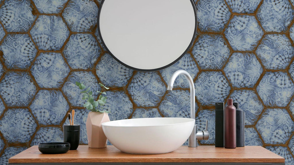 Unique splatter print, blue hexagonal porcelain tile in a bathroom backsplash