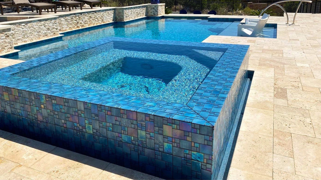 mixed format, iridescent blue tile surrounding a spa