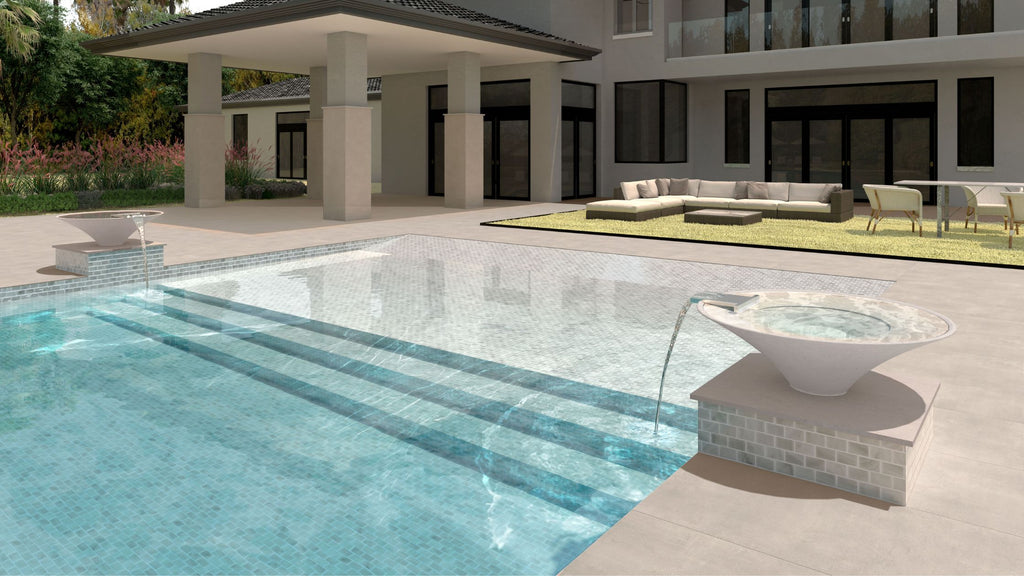 Light colored neutral tiles used in an all glass tile pool in the backyard of a luxury home.