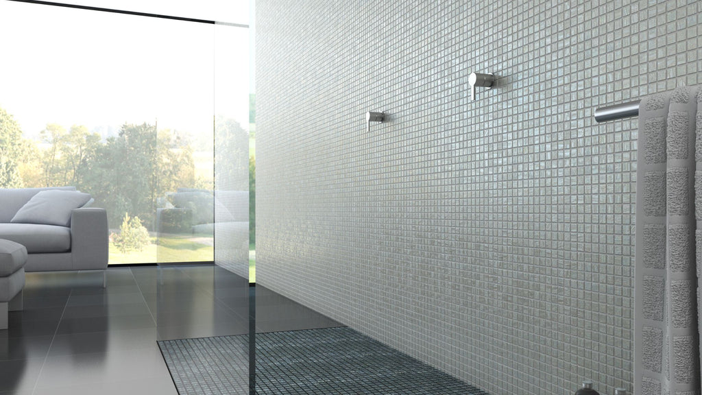 White tile from the Moon Collection by Vidrepur. It's installed along an entire bathroom shower wall. The bathroom features a see-through glass shower wall and is in an ultra-modern style.