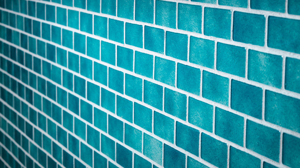 A close up of beautiful turquoise blue tile from Murrine Mosaics.