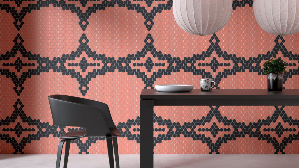 Peach glass tile used in an accent wall in a dining area. Theres a black diamond pattern installed in it. Theres a black kitchen table and chair.