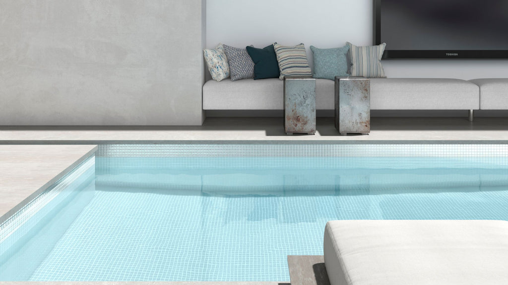 White tile from the Shell collection installed in a modern, luxury all-glass tile pool.