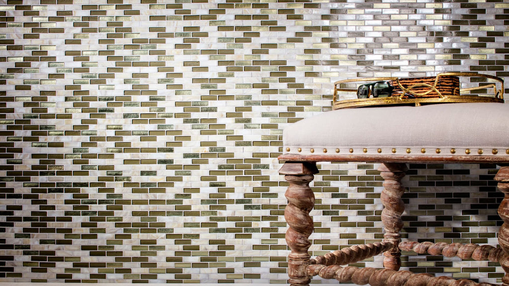 Opal Blends small rectangular tile on an accent wall. It's a blend of light cream colors, browns, and light shaded golds with an iridescent finish.