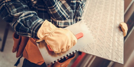 contractor back-buttering tile