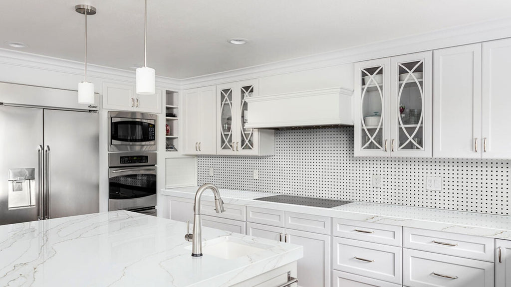 Black and white basketweave backsplash tile in a bright and airy kitchen.