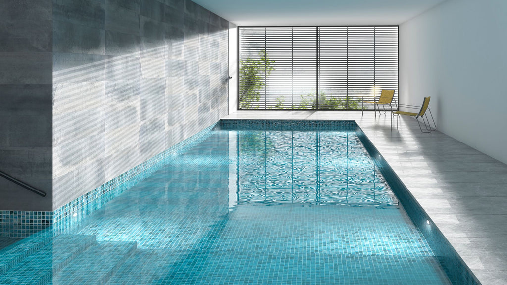 An indoor all glass tile pool in a commercial application.