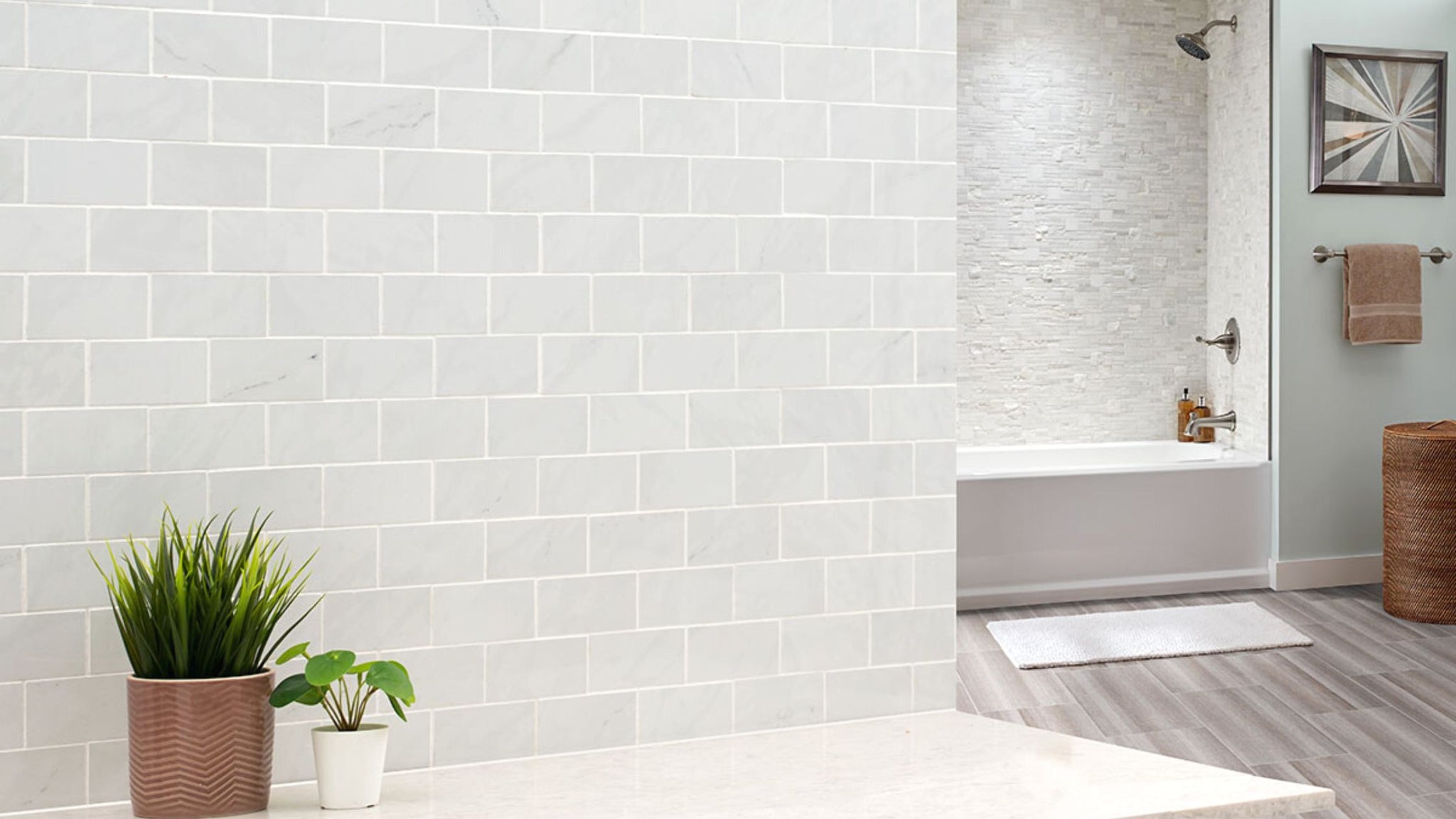 marble look subway tile accent wall in bathroom