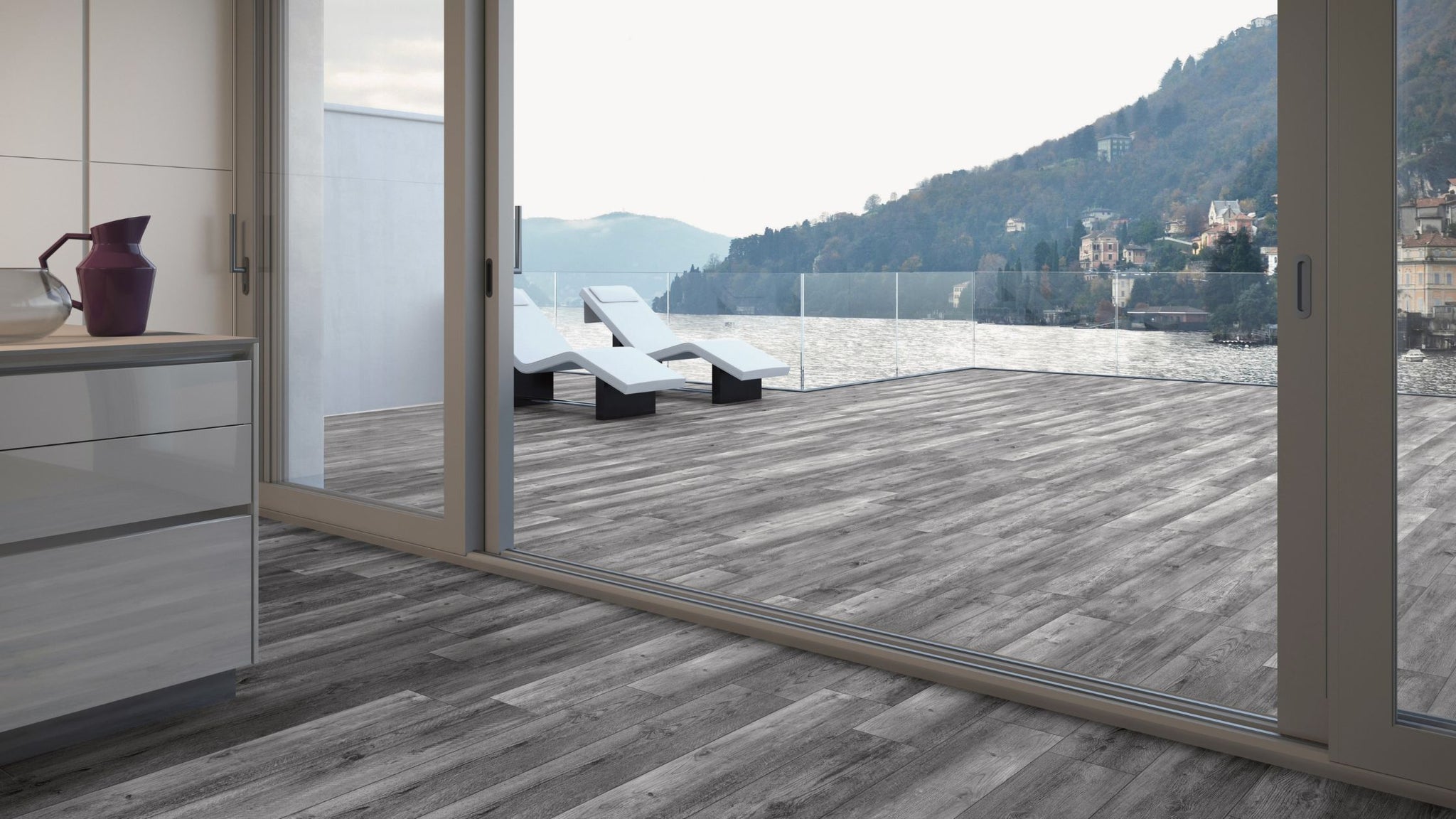 wood look porcelain pavers in modern outdoor space that transition into matching porcelain tile in the home