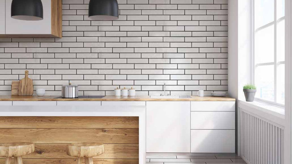 white subway tile backsplash with black grout