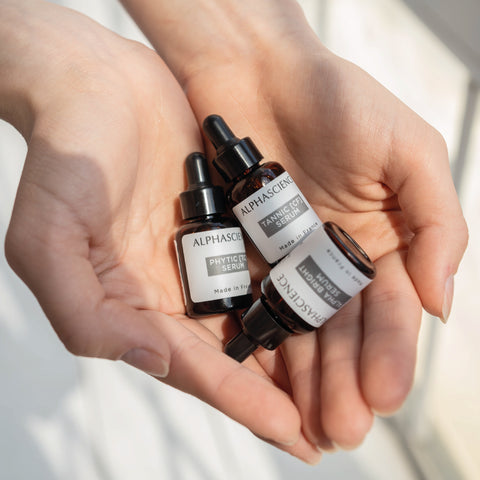 Alphascience antioxidant serums 8 ml travel size in hands. Perfect for travel.