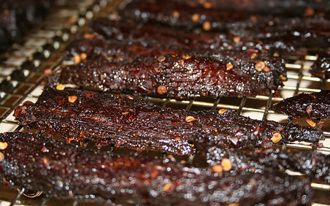 https://cdn.shopify.com/s/files/1/1206/6042/files/Golden-Toad-Beef-Jerky-Smoked-1600x1000_large.jpg?3761952372271171701