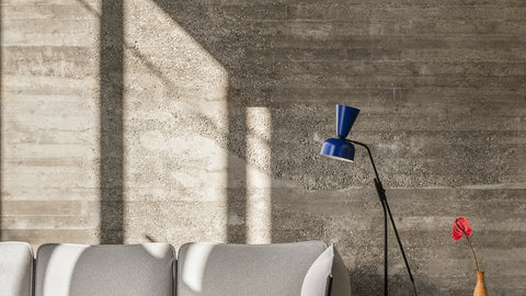 An image of a Blue Alphabeta Floor Lamp next to a Kumo Sofa in Porcelain.