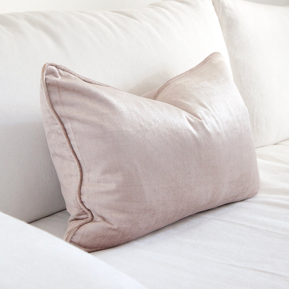 dusty pink rectangle velvet cushion on white sofa