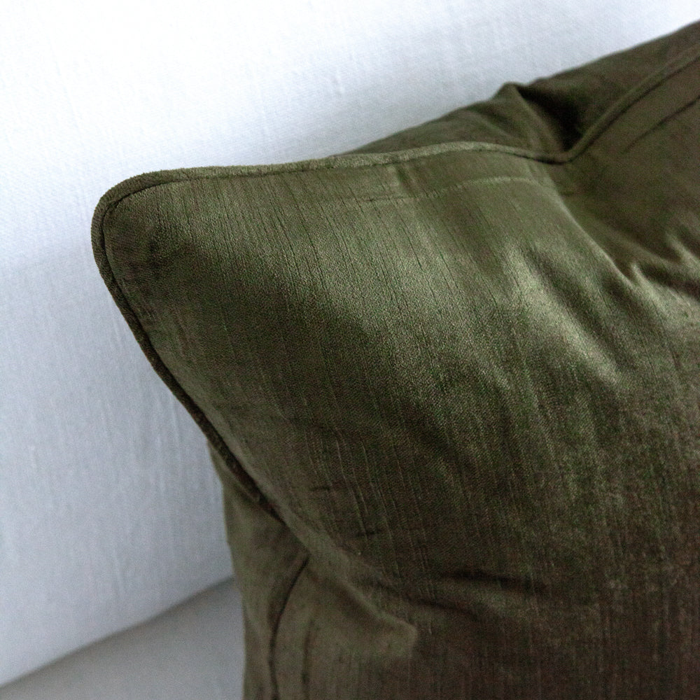 close up of dark green velvet cushion