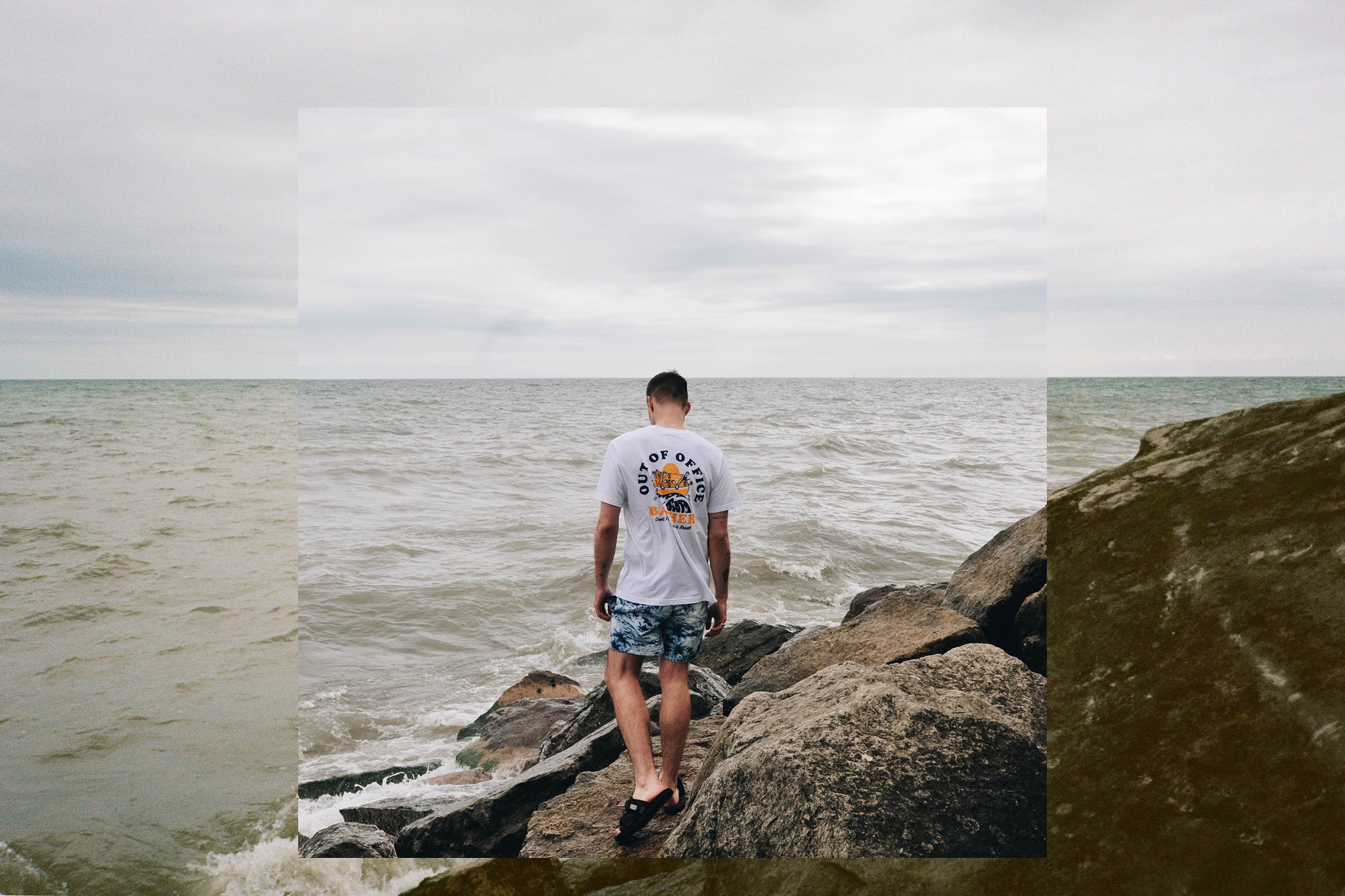 Man walking on rocks near water