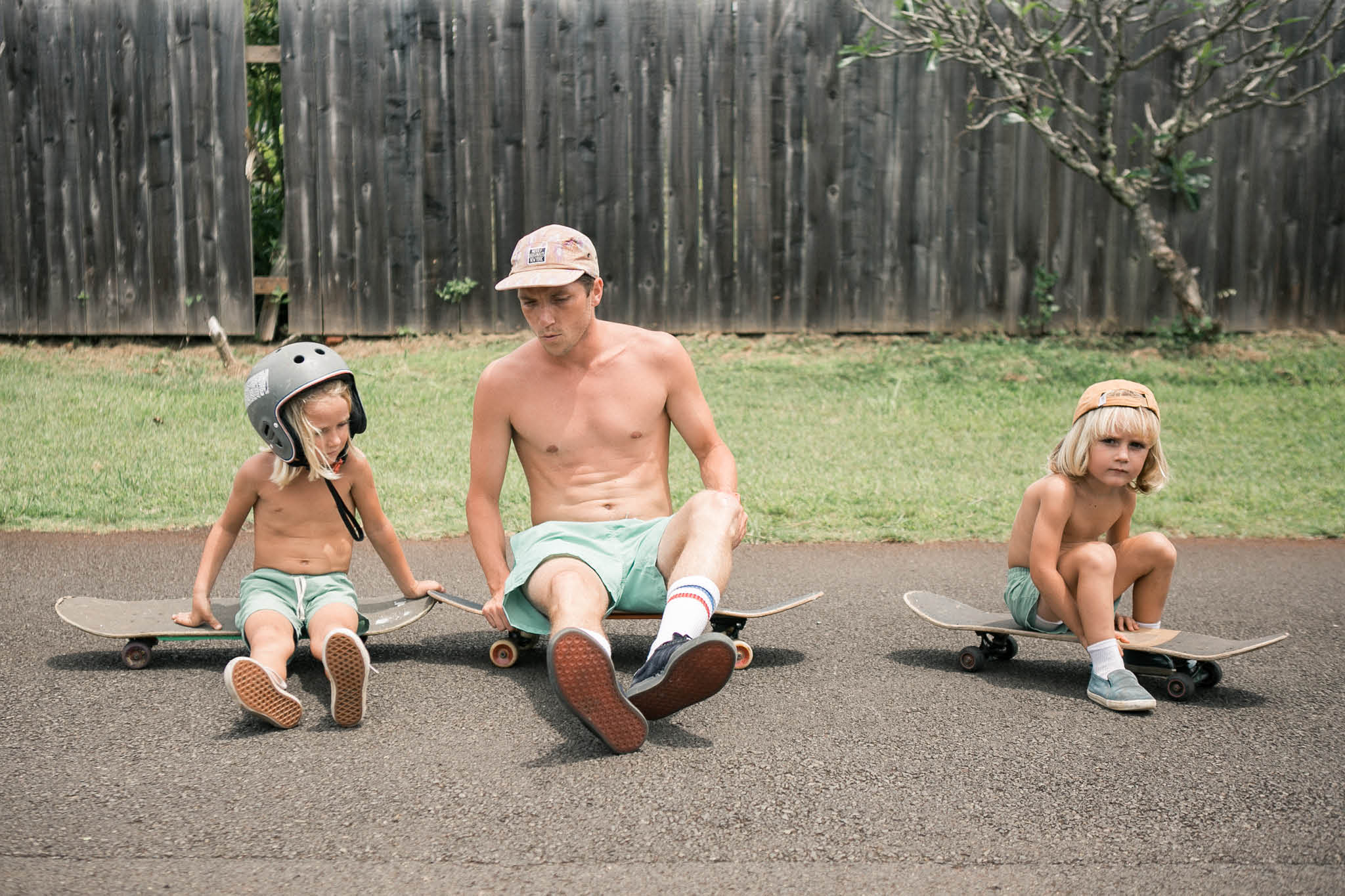 Father and son skateboarding in Bather swim trunks