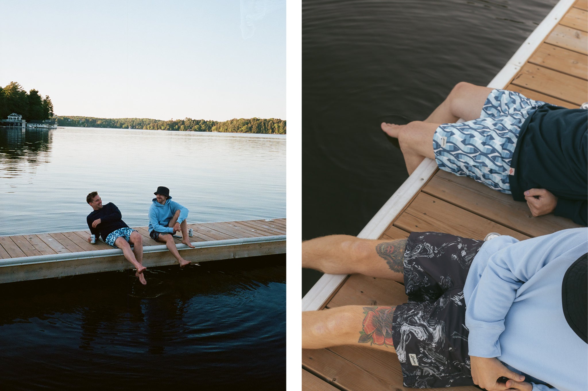 Two men sitting on a lake dock wearing hoodies and swim trunks while the sun sets